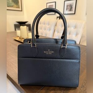 Kate Spade black leather purse, has crossbody strap. New with tags